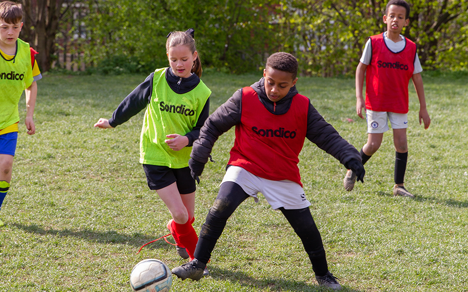 children playing football