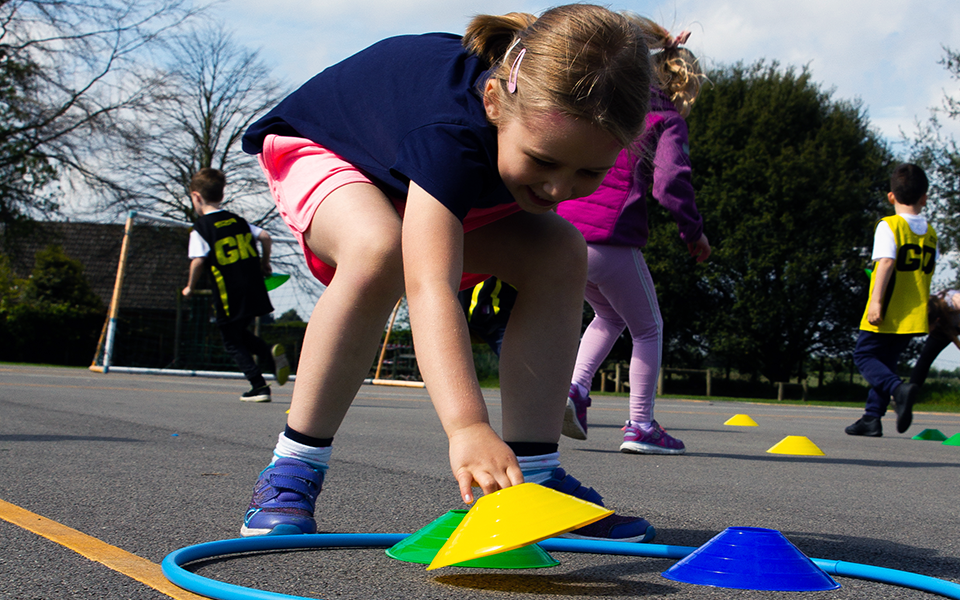 young girl touching cone